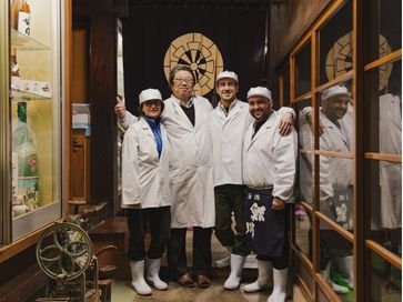 Participants taking part in a group sake-brewing course in Japan